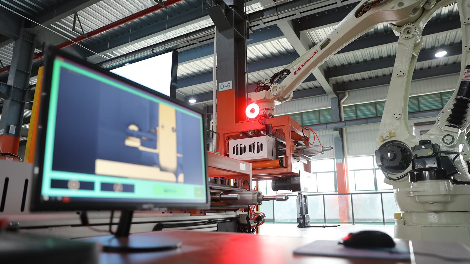 Robotic manufacturing equipment in the customer-supplied factory photograph